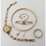 A 9ct gold bangle, 9ct cased ladies watch, peridot and pearl brooch and other items, weight combined