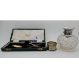 A lot comprising a cased two piece silver christening set, Sheffield 1938, a silver topped scent