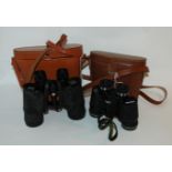 Two pairs of modern binoculars in cases Condition Report: Available upon request