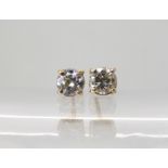 A pair of 9ct gold diamond stud earrings of estimated approx combined 0.60cts, weight 1gm
