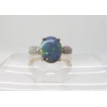 A 9ct opal and diamond ring size O, weight 3.2gms Condition Report:
