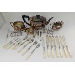 A tray lot of EP - tea service, toastracks, loose cutlery etc Condition Report: Available upon
