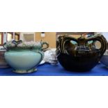 A German pottery secessionist style jardiniere and a dark green glazed jardiniere Condition