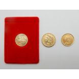 Two gold half sovereigns, 1887 and 1979 with a USA gold coin 1886