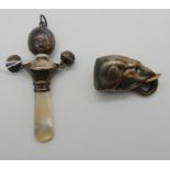 A lot comprising a silver and mother of pearl baby rattle and a metal Elephant's head vesta