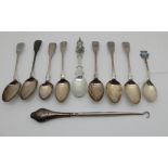 A lot comprising assorted silver and white metal spoons and a silver handled buttonhook (a lot)