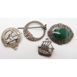 A collection of silver brooches to include a Ward Brothers Viking boat brooch, a silver clan badge
