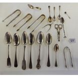 A lot comprising six assorted silver tablespoons, a silver caddy spoon, white metal and silver