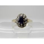 A 9ct sapphire and diamond cluster ring, set with estimated approx 0.20cts of brilliant cut