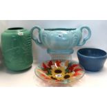 A Wedgwood green glazed panther vase, two other pottery vases and a glass dish decorated with