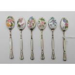 A cased set of six silver, floral and enamel coffee spoons Condition Report: Available upon request