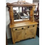An oak Arts and Crafts mirrored back sideboard with carved panel doors Condition Report: