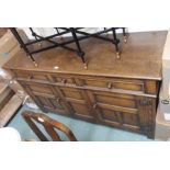 An oak sideboard with three drawers over two panel doors Condition Report: Available upon request