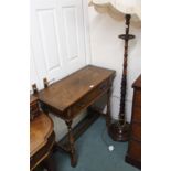 An oak hall table and a mahogany standard lamp (2) Condition Report: Available upon request