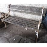A garden bench with cast iron ends Condition Report: Available upon request