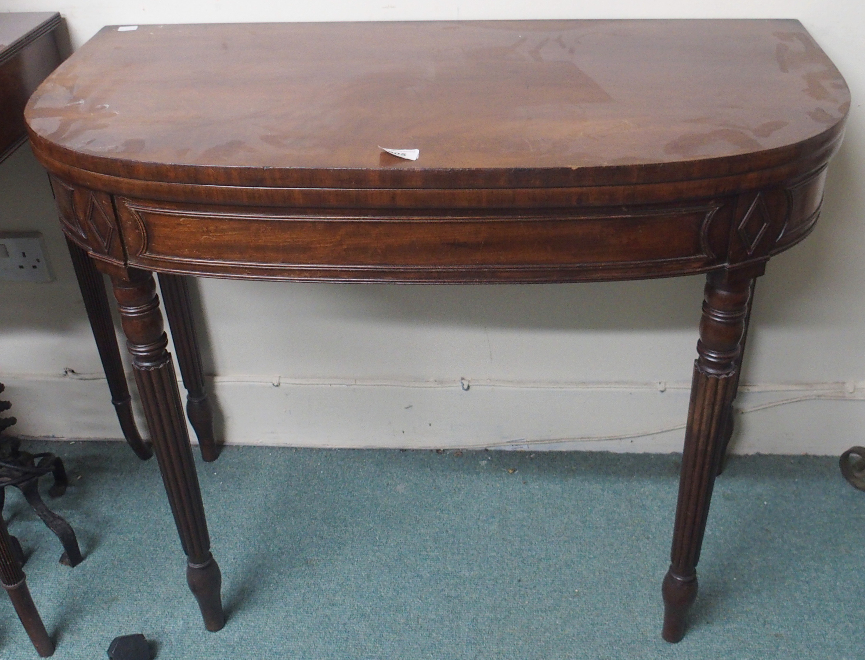 A mahogany fold-over tea table Condition Report: