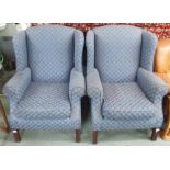 A pair of blue upholstered Marks and Spencer wing back chairs (2) Condition Report: Available upon