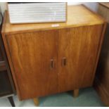 A teak two door record cabinet Condition Report: Available upon request