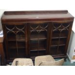 A mahogany three door glazed display cabinet Condition Report: Available upon request
