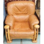 A leather armchair with oak frame Condition Report: Available upon request