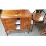 A mahogany cabinet with tambour front and an occasional table (2) Condition Report: Available upon
