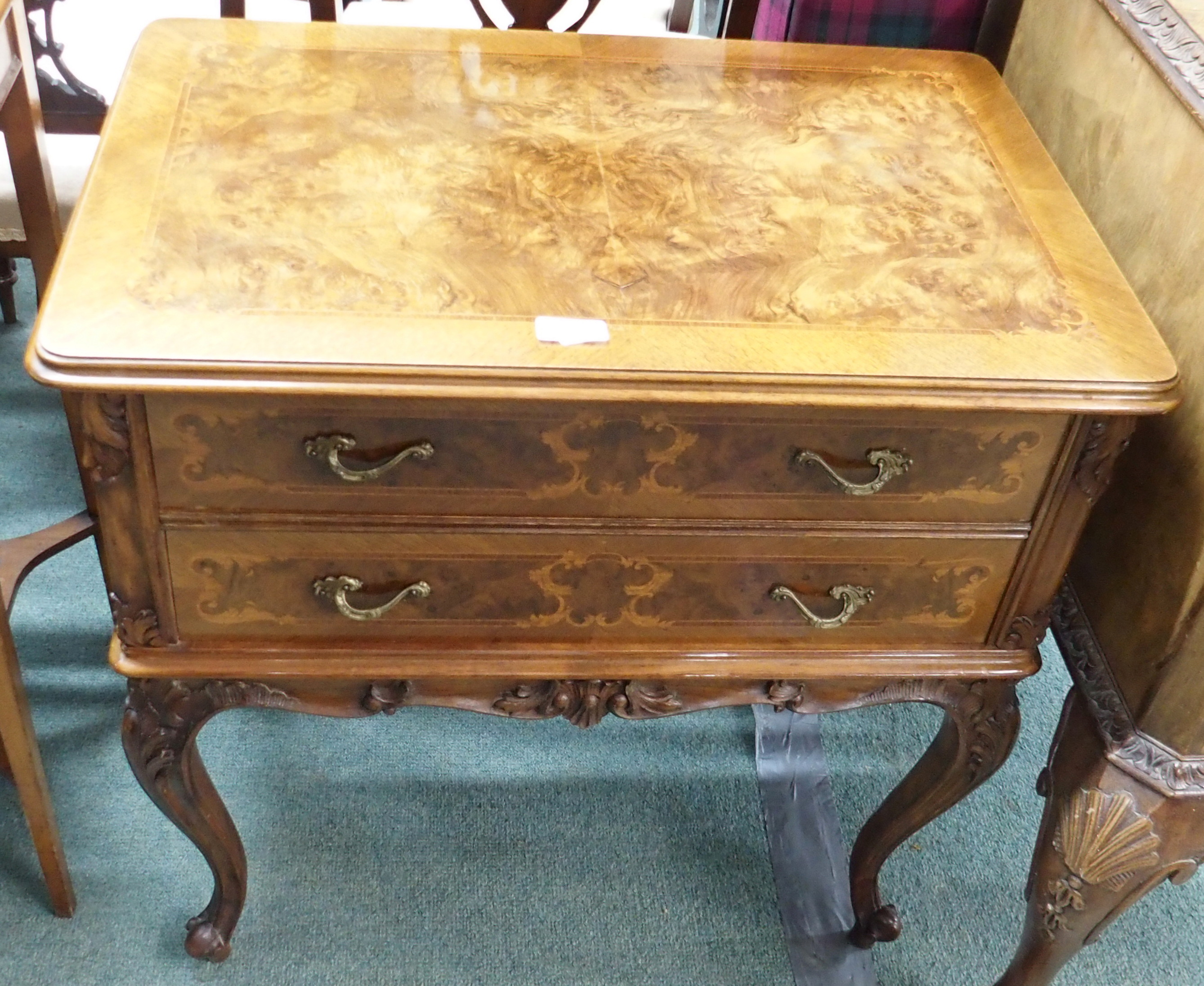 A reproduction walnut two drawer chest on legs Condition Report: Available upon request