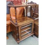 A Victorian walnut music cabinet with single glazed door Condition Report: Available upon request