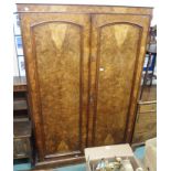 A burr walnut and mahogany wardrobe with fitted interior Condition Report: Available upon request