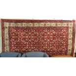 A red ground Kasmir rug with allover floral design, 230cm x 145cm Condition Report: Available upon