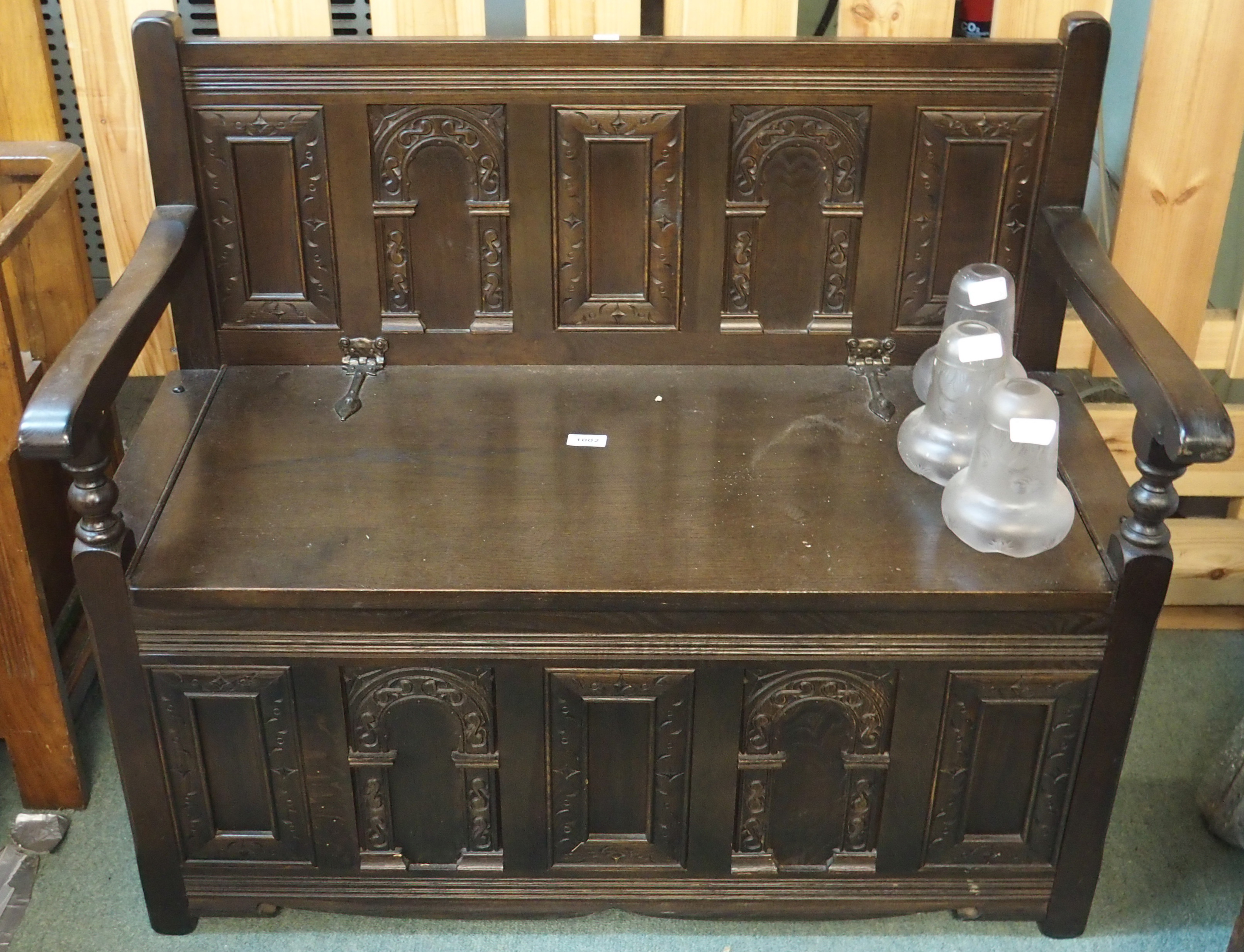 A carved oak hall bench Condition Report: Available upon request