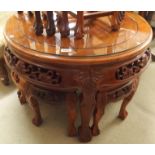 A Chinese hardwood circular table with four nesting tables Condition Report: Available upon request