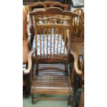 An early 20th Century folding chair and an armchair (2) Condition Report: Available upon request