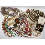 A collection of vintage costume jewellery to include, good beads, a red gem pendant, beaded collar
