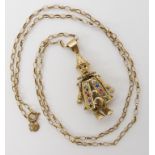 A 9ct gold gem set clown pendant length 4cm, with 9ct chain length 56cm, weight cobined 9gms