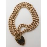 A 9ct gold double curb chain bracelet with a heart clasp length 17cm, weight 15.2gms Condition