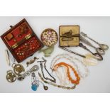 A collection of vintage costume jewellery to include, coral beads, amber items, a soapstone duck etc