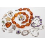 A Hamish Dawson Bowman lion brooch, an amber bead necklace and other items Condition Report: Not