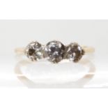 A bright yellow and white metal three stone diamond ring set with estimated approx 0.75cts of