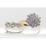 A 14k gold cubic zirconia cluster ring size Q1/2, weight 3.2gms, and a 9ct three clear gemstone ring