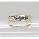 An 18ct gold three stone diamond ring, set with estimated approx 0.25cts, size O, weight 2.7gms