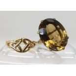 A large yellow metal smoky quartz ring quartz approx 20mm x 15mm, finger size J approx, together