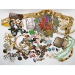 A collection of vintage costume jewellery to include, a wedding tiara, a beaded panel, a continental