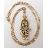 A large gem set clown pendant length 7cm, with a 9ct figaro chain length 60cm, combined weight 27.