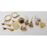 A pair of 9ct gold gem set clown earrings length 3.5cm, a boot charm, diamond set ingot shaped