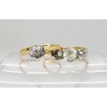 An 18ct gold three clear gem set ring (one stone missing) size P, and a 18ct diamond cluster ring (