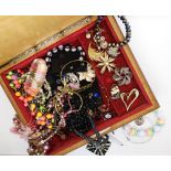 A wooden box full of costume jewellery to include a brooch by Sphinx Condition Report: Not available