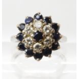 An 18ct white gold sapphire and diamond cluster ring size N1/2. Set with estimated approx 0.42cts of