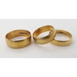 Three 9ct gold wedding rings sizes W,U and V1/2, combined weight 12gms Condition Report: Available