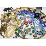 A collection of vintage costume jewellery to include, a silver turquoise and marcasite ring, beads