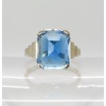 A 14k white gold ring set with a blue glass gem, size J1/2, weight 3.9gms Condition Report: Glass